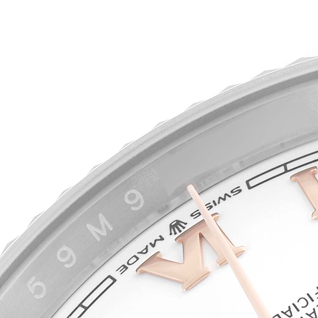 The image shows a close-up of the dial of a Rolex Datejust 126231 Men's Steel and Gold (two tone) White Dial 126231 Men's Steel and Gold (two tone) White Dial watch, focusing on the Roman numeral "VI," seconds hand, and the "Swiss Made" marking.