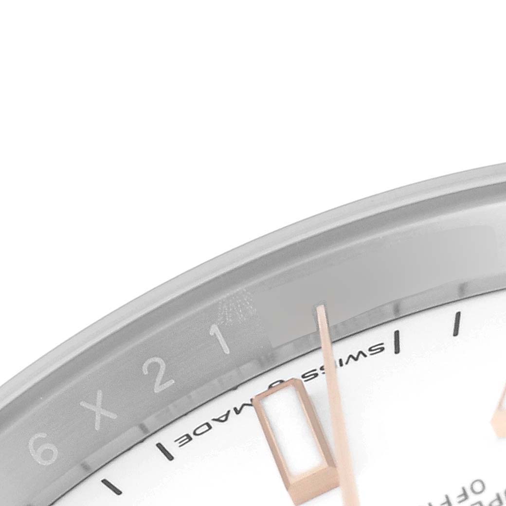 The image shows a close-up section of the dial of a Rolex Datejust 126231 Men's Steel and Gold (two tone) White Dial 126231 Men's Steel and Gold (two tone) White Dial watch, focusing on the minute and hour markers.