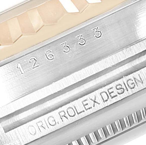 The image shows a close-up of the Rolex Datejust 41 126333 Men's Steel and Gold (two tone) Champagne Dial 126333 Men's Steel and Gold (two tone) Champagne Dial watch case engraving with serial number and "ORIG.ROLEX DESIGN" text.