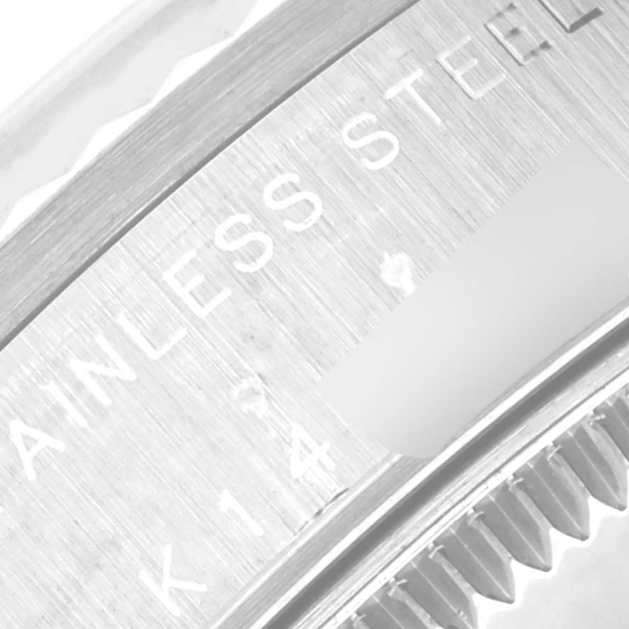The image shows a close-up of the stainless steel case back edge and serial number of a Rolex Mid-Size 78274 Women's Stainless Steel Mother of Pearl Dial 78274 Women's Stainless Steel Mother of Pearl Dial watch.