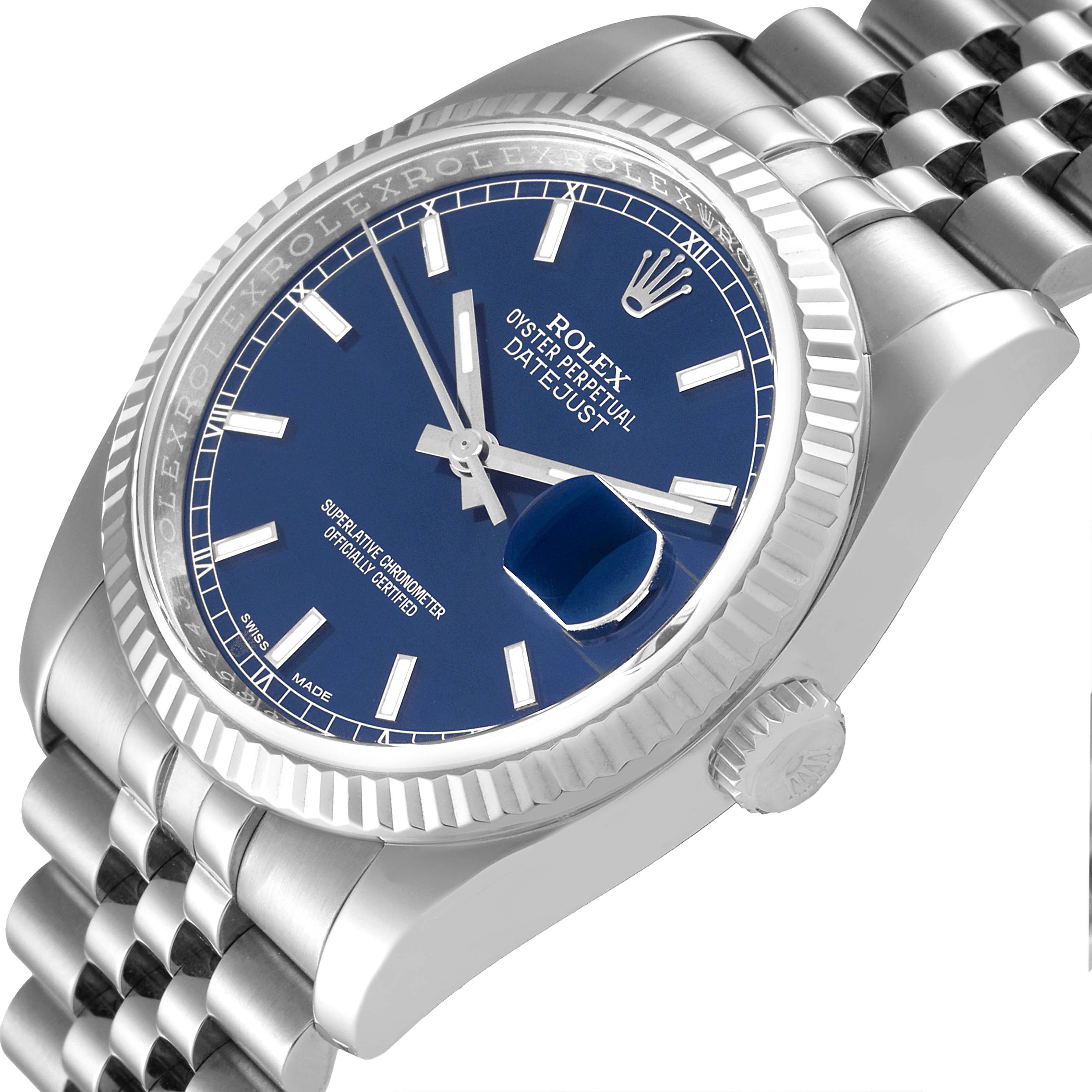 The image displays a close-up view of the Rolex Datejust 116234 Men's Stainless Steel Blue Dial 116234 Men's Stainless Steel Blue Dial watch showing the blue dial, fluted bezel, crown, and part of the bracelet.