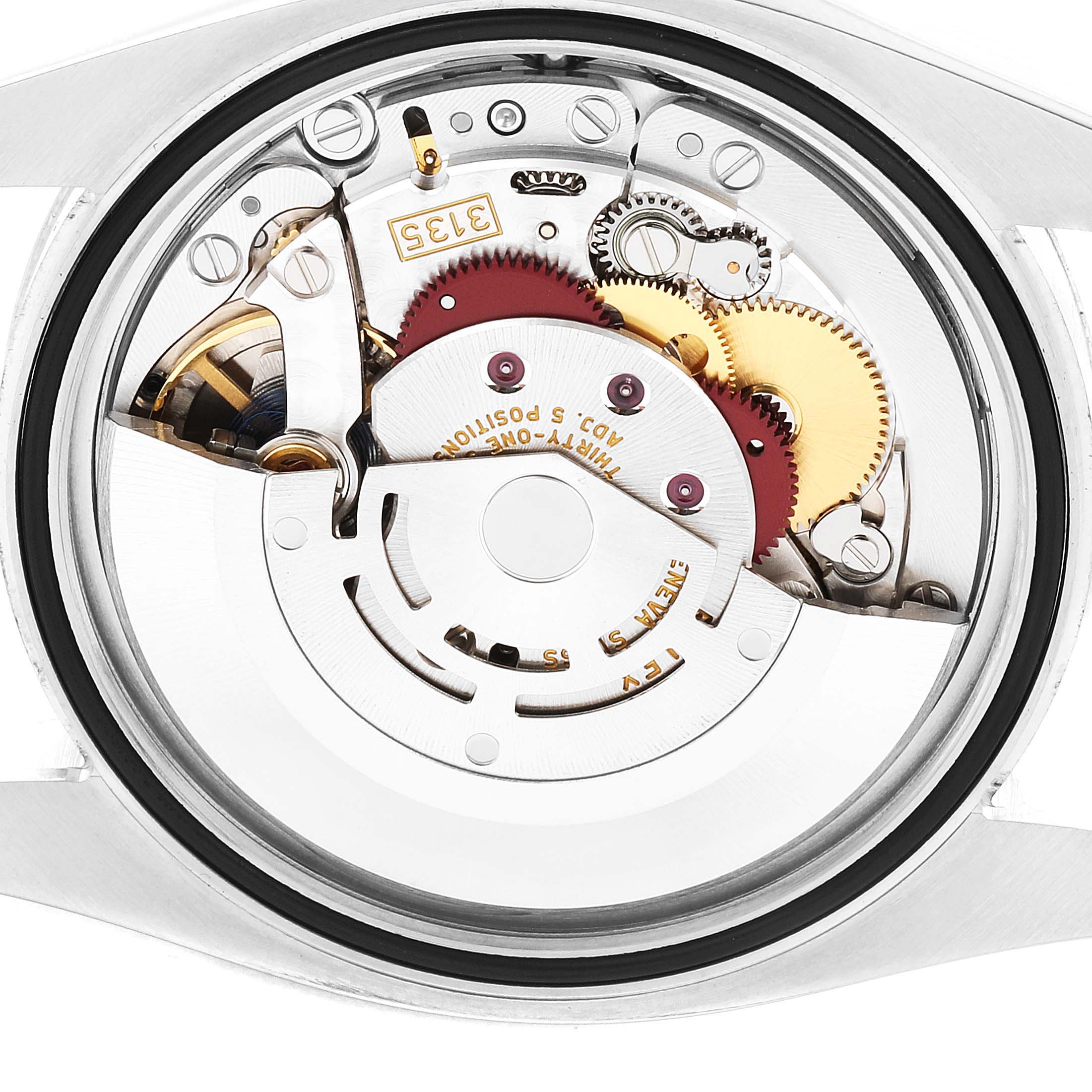 This image shows a close-up view of the internal movement of a Rolex Datejust 116234 Men
s Stainless Steel Black Dial 116234 Men
s Stainless Steel Black Dial watch.