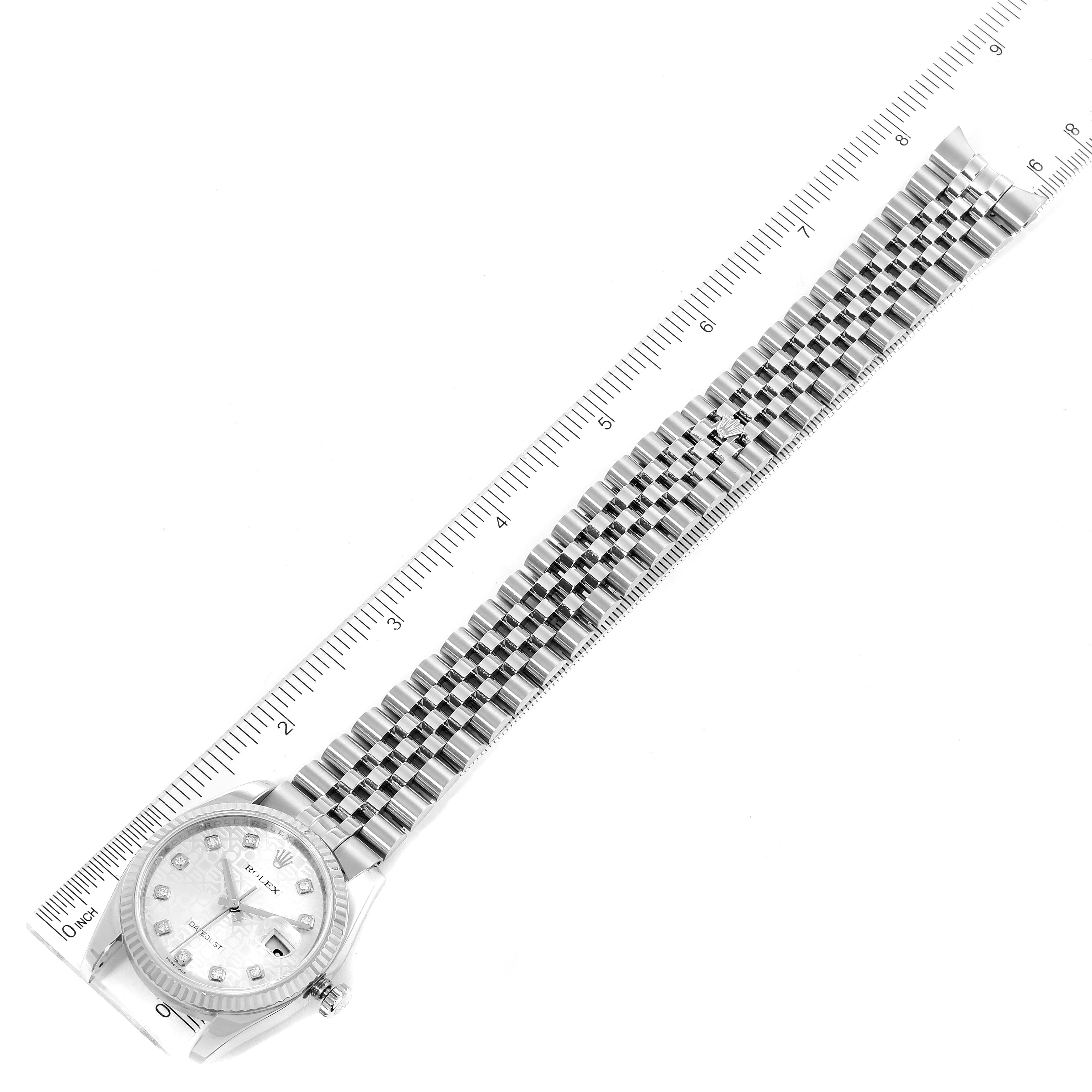 The image shows a top-down view of a Rolex Datejust 116234 Men's Stainless Steel Silver Dial 116234 Men's Stainless Steel Silver Dial watch, including the dial, bezel, and entire metal bracelet, with a ruler for scale.