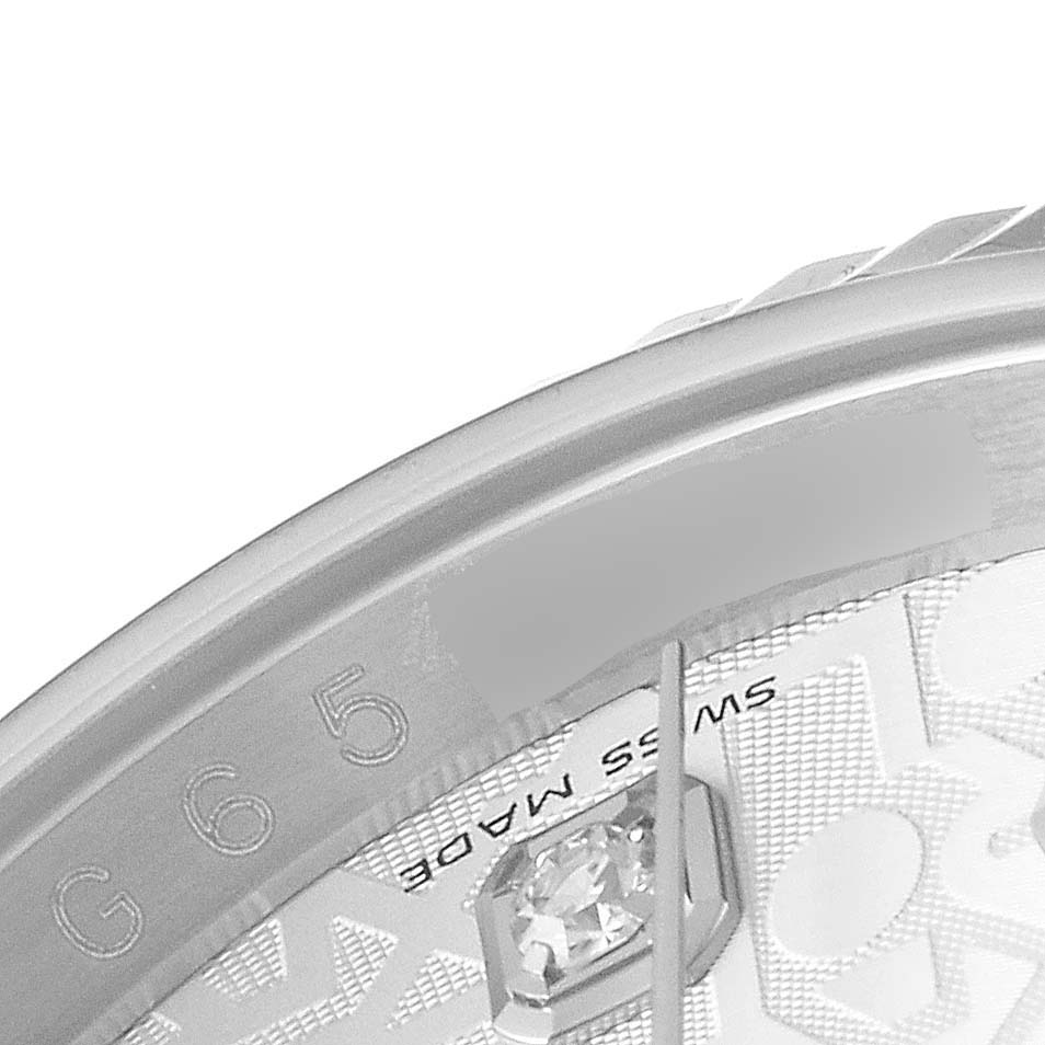 This close-up image of the Rolex Datejust 116234 Men's Stainless Steel Silver Dial 116234 Men's Stainless Steel Silver Dial watch shows part of the dial, a diamond marker, and a portion of the bezel.