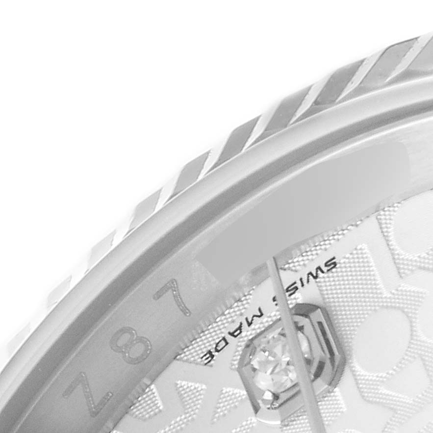 This close-up image shows a part of the bezel and dial of a Rolex Datejust 116234 Men's Stainless Steel Silver Dial 116234 Men's Stainless Steel Silver Dial watch.