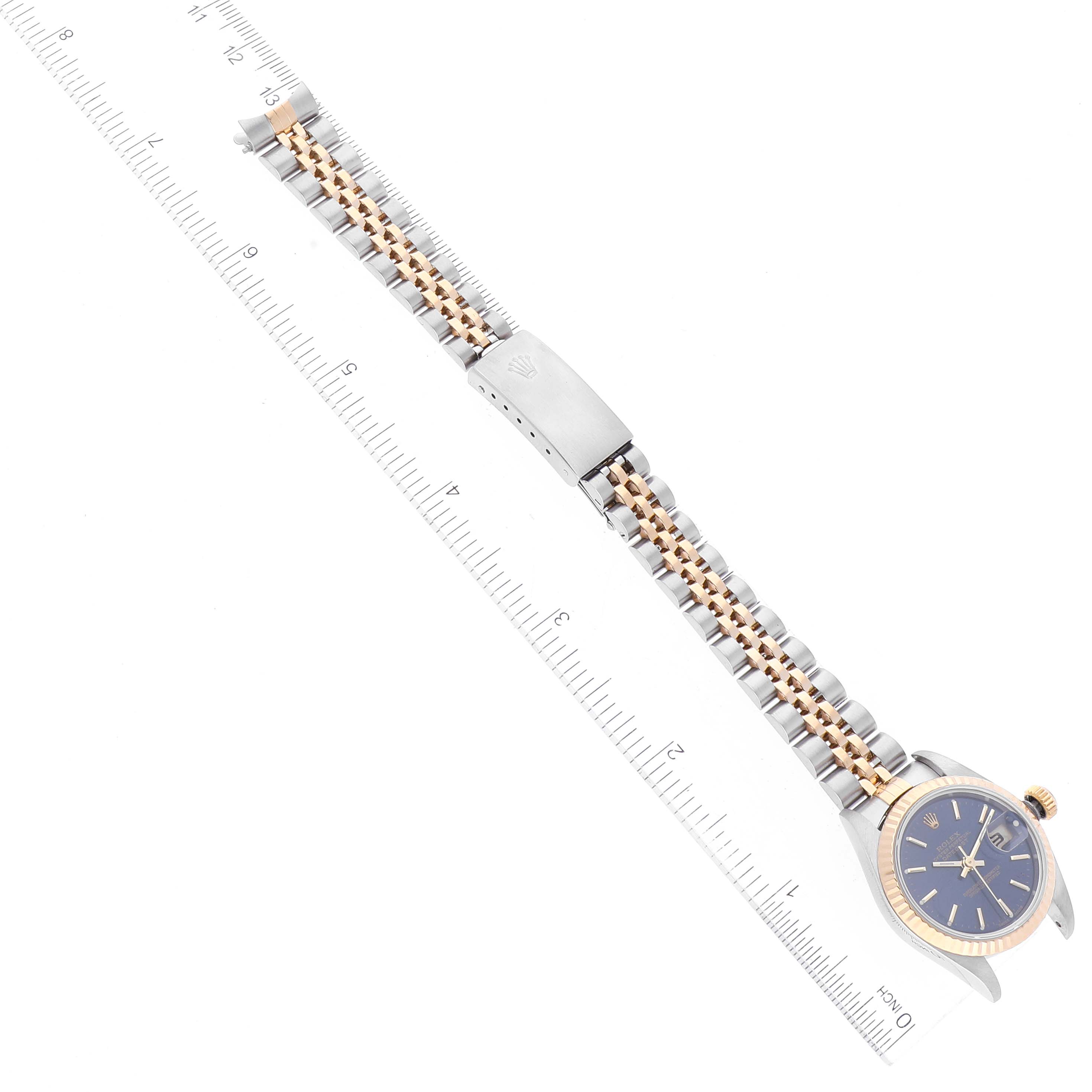 The image shows a Rolex Datejust 79173 Women's Steel and Gold (two tone) Blue Dial 79173 Women's Steel and Gold (two tone) Blue Dial watch with a blue dial and a two-tone bracelet, aligned horizontally with a ruler.