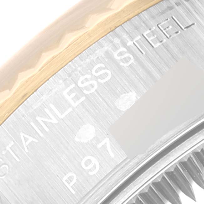 This close-up image shows the edge of the case and part of the fluted bezel of a Rolex Datejust 79173 Women's Steel and Gold (two tone) Blue Dial 79173 Women's Steel and Gold (two tone) Blue Dial watch, with "Stainless Steel" inscribed.