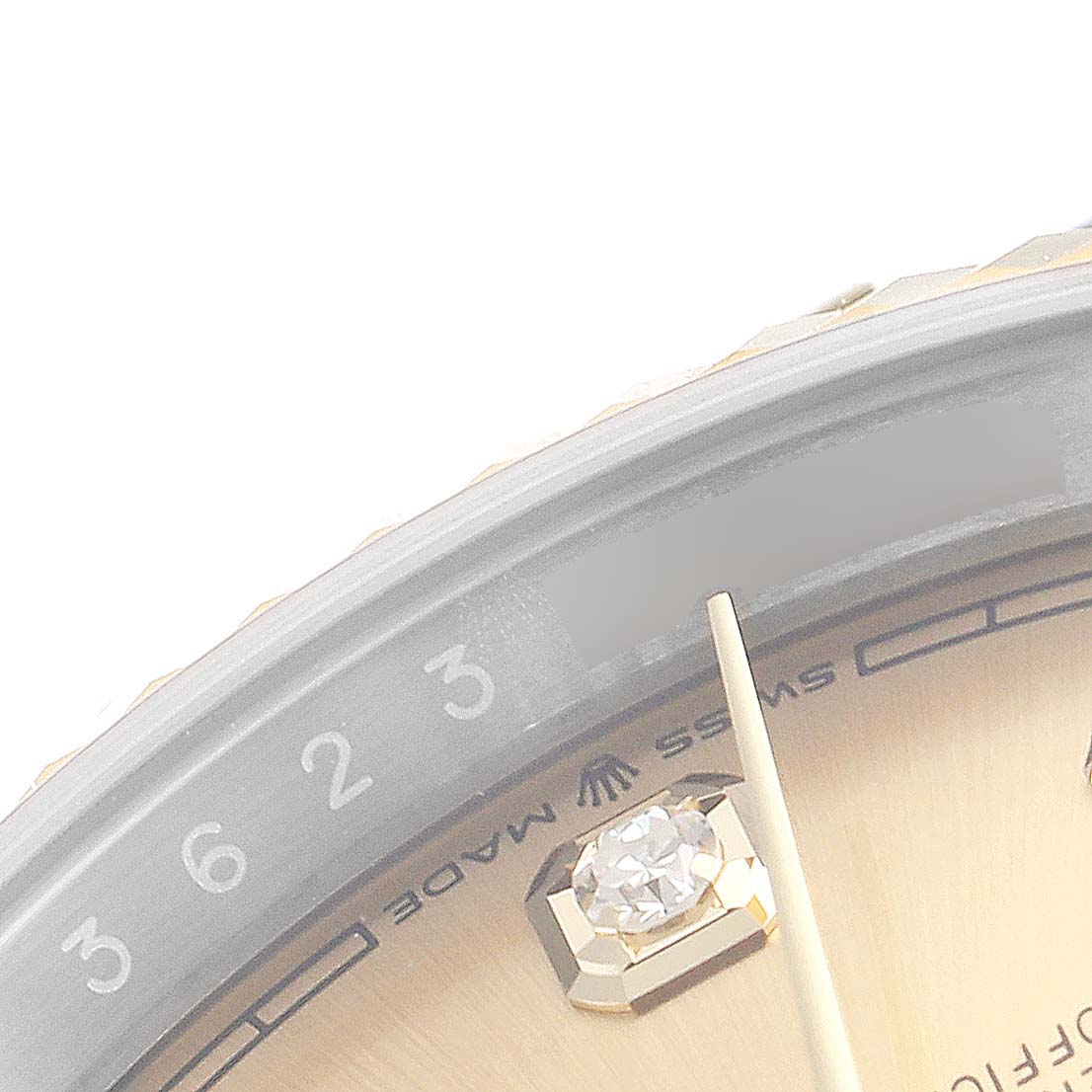 This image shows a close-up of the dial, date indicator, and one hour indicator of a Rolex Datejust 126233 Men's Steel and Gold (two tone) Champagne Dial 126233 Men's Steel and Gold (two tone) Champagne Dial watch.