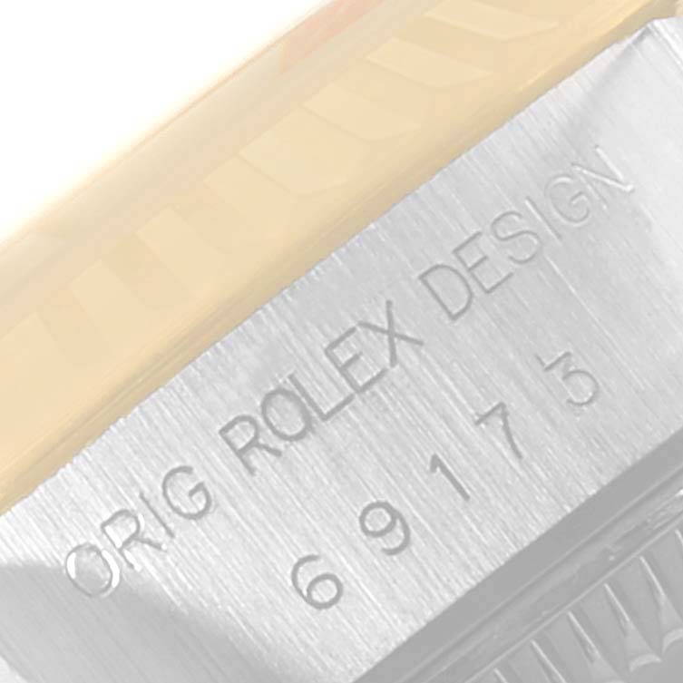 The image shows a close-up angle of the case side engraving on a Rolex Datejust 69173 Women
s Steel and Gold (two tone) Champagne Dial 69173 Women
s Steel and Gold (two tone) Champagne Dial watch.