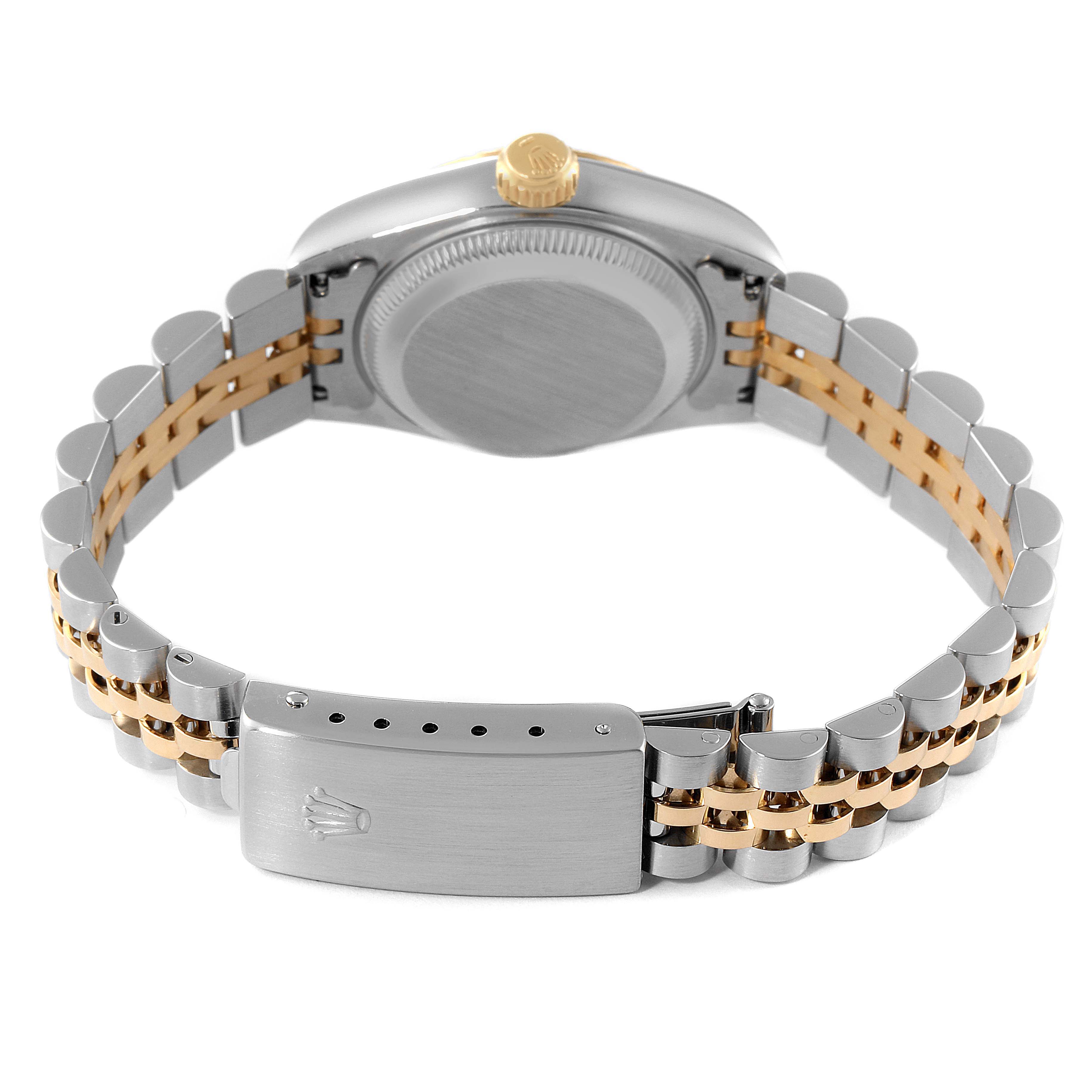 This image shows the back view of a Rolex Datejust 69173 Women
s Steel and Gold (two tone) Champagne Dial 69173 Women
s Steel and Gold (two tone) Champagne Dial watch, highlighting its case back and two-tone metal bracelet with a clasp.