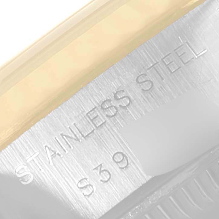 The image shows a close-up of the stainless steel back case of a Rolex Datejust 69173 Women
s Steel and Gold (two tone) Champagne Dial 69173 Women
s Steel and Gold (two tone) Champagne Dial watch.