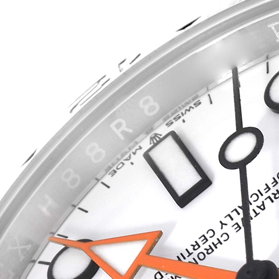 This image shows a close-up of the face and details of a Rolex Explorer 226570 Men's Stainless Steel White Dial 226570 Men's Stainless Steel White Dial watch, focusing on the hands, indices, and part of the bezel.