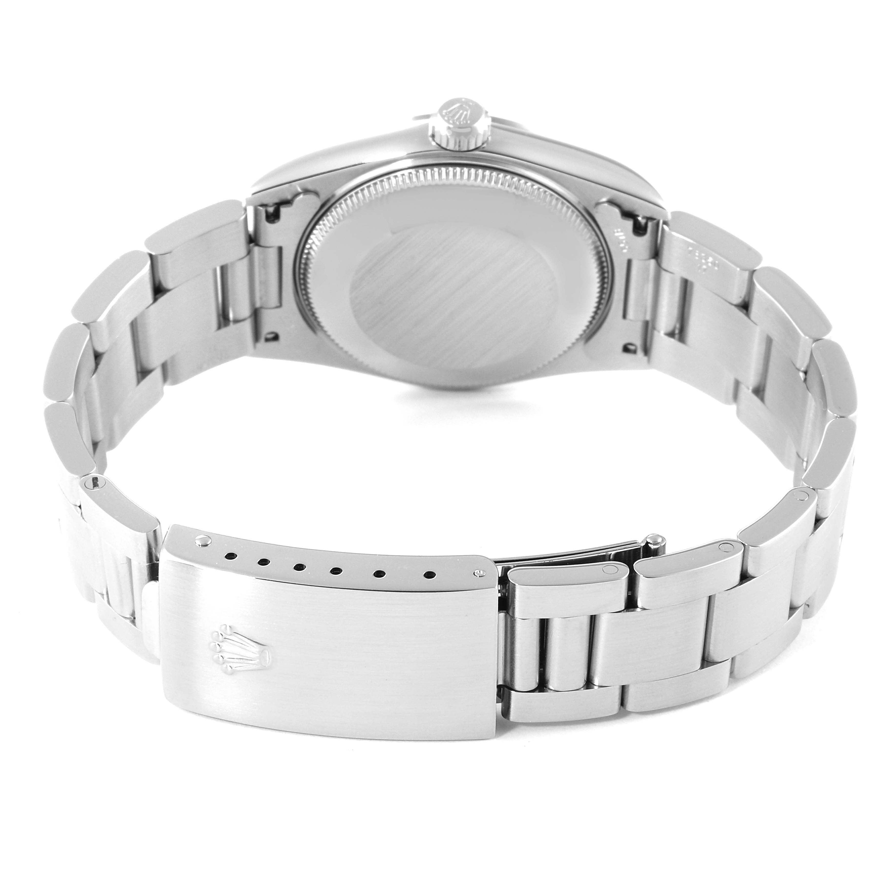 This image shows the back view of a Mid-Size Rolex watch, featuring the case back and the opened bracelet clasp.