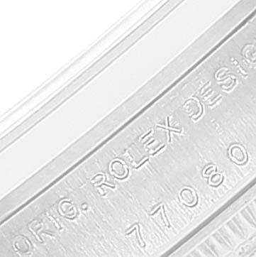 This image shows a close-up of the model number and "ORIG. ROLEX DESIGN" engraving on the case of a Rolex Mid-Size 77080 Women's Stainless Steel Blue Dial 77080 Women's Stainless Steel Blue Dial watch.