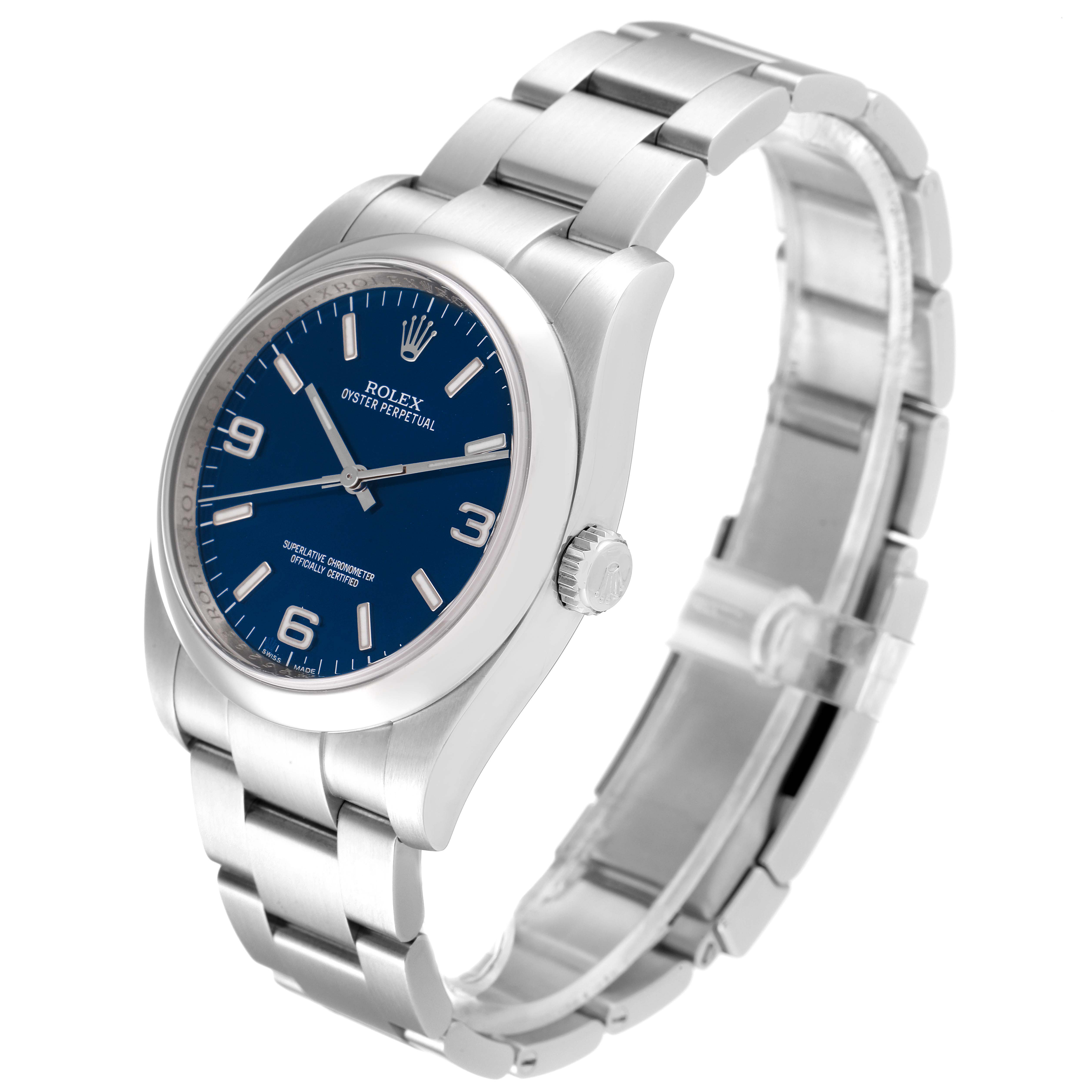 The image shows a Rolex Oyster Perpetual 116000 Men's Stainless Steel Blue Dial 116000 Men's Stainless Steel Blue Dial watch from a side angle, highlighting the face, crown, and bracelet.