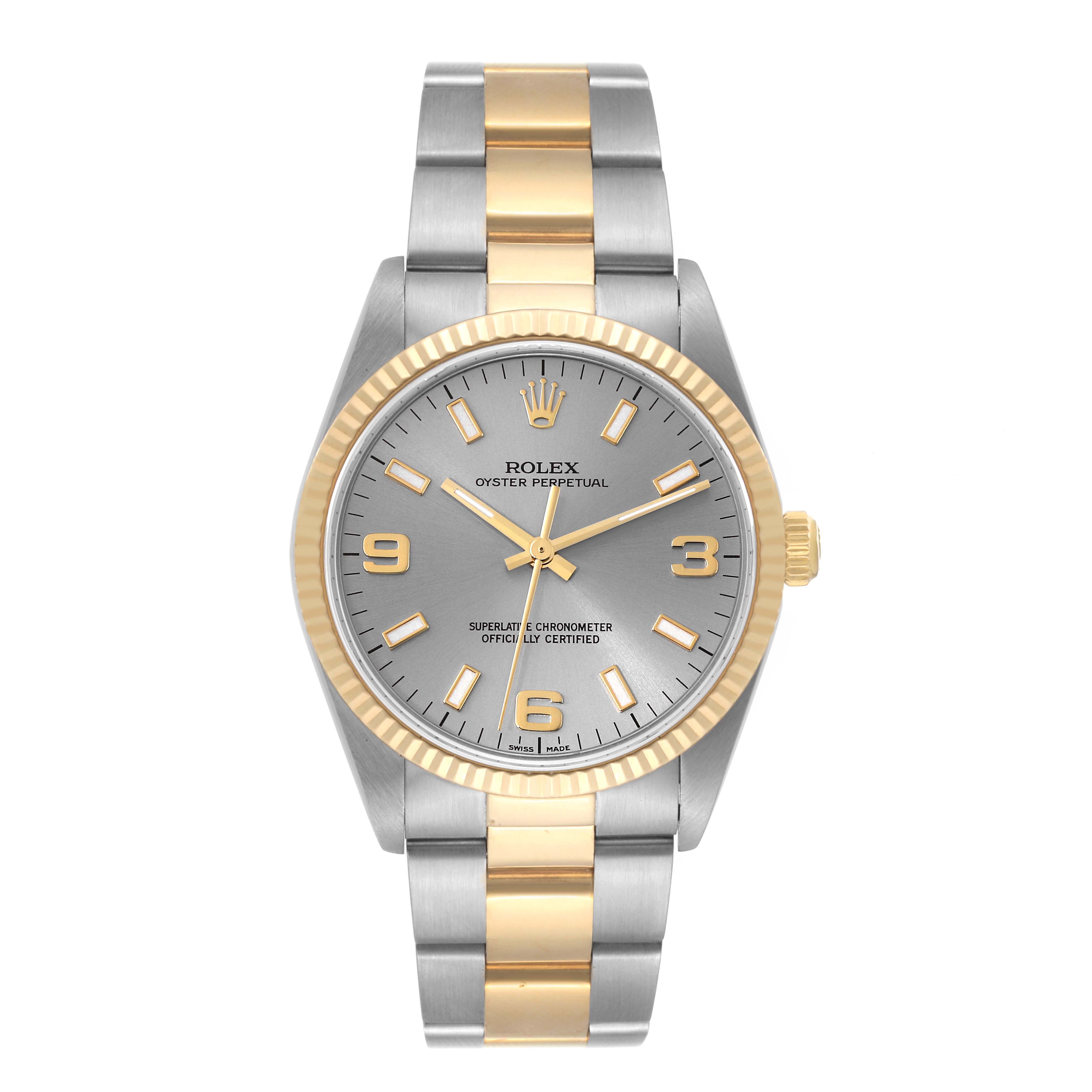 The Rolex Oyster Perpetual 14233 Men's Steel and Gold (two tone) Grey Dial 14233 Men's Steel and Gold (two tone) Grey Dial watch is shown from a front angle, displaying the face, bezel, and bracelet.