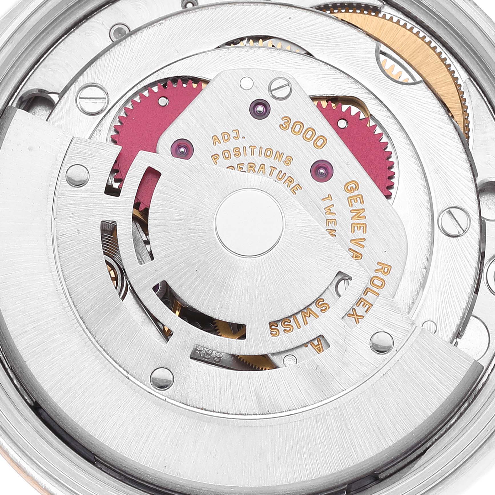 This image shows an overhead view of the intricate internal mechanism of a Rolex Oyster Perpetual 14233 Men's Steel and Gold (two tone) Grey Dial 14233 Men's Steel and Gold (two tone) Grey Dial watch, highlighting gears and the rotor.