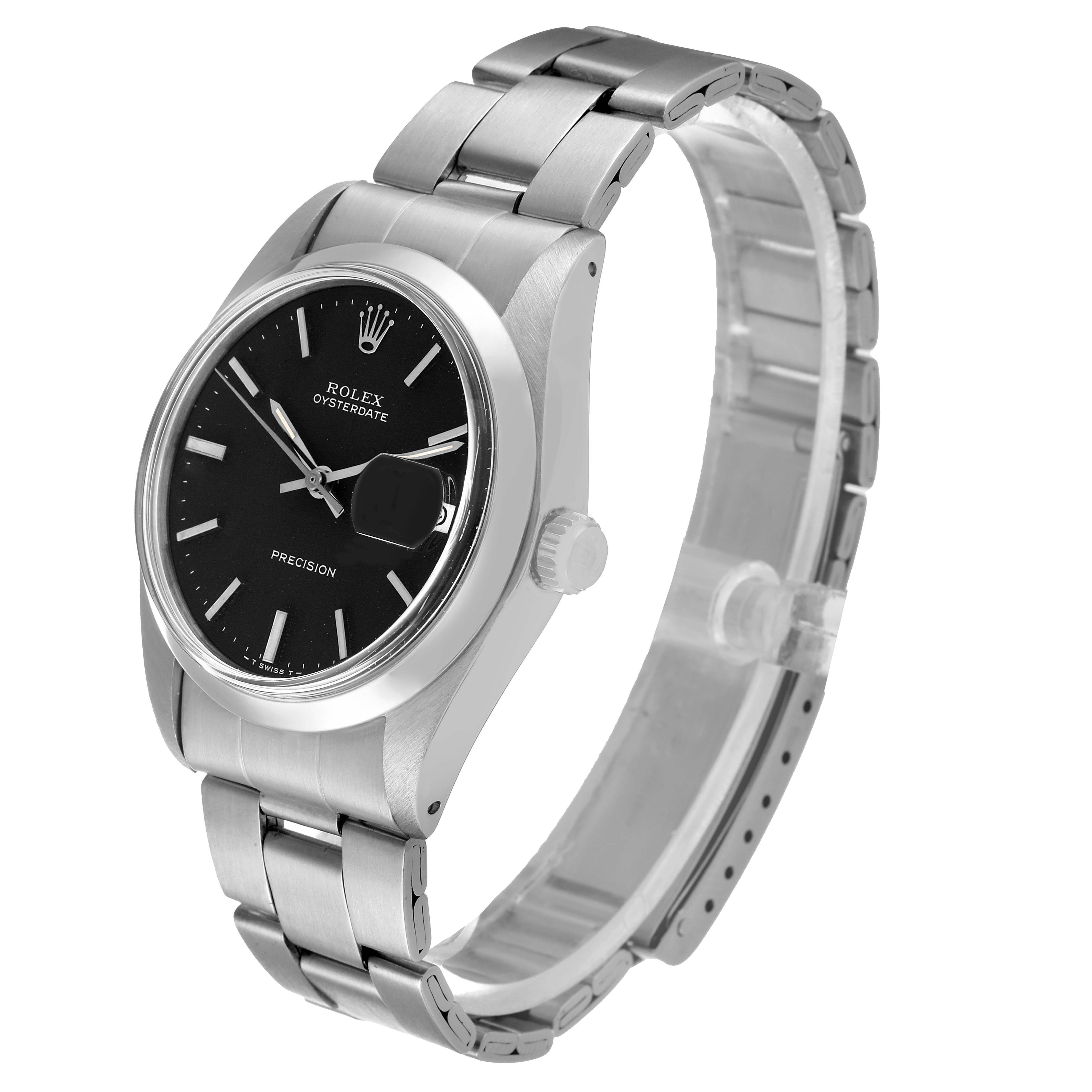 The Vintage Collection Rolex Oysterdate watch is shown at a slight angle, highlighting its black dial, case, crown, and metal bracelet.