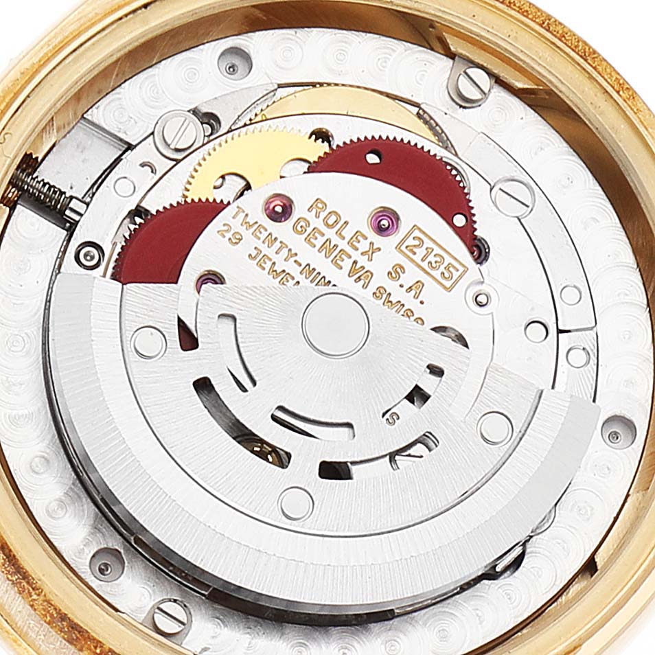 This image shows the internal mechanism of the Rolex President 68288 Women
s Yellow Gold Champagne Dial 68288 Women
s Yellow Gold Champagne Dial model, focusing on the movement and gears.