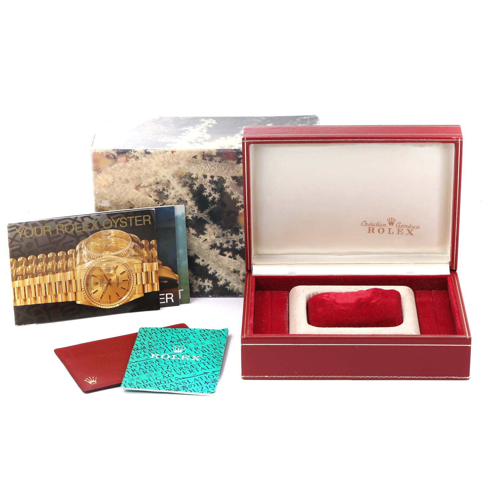 The image shows a Rolex President 68288 Women
s Yellow Gold Champagne Dial 68288 Women
s Yellow Gold Champagne Dial watch packaging with manuals, a Rolex box, and a Rolex branded outer cover from a side angle.