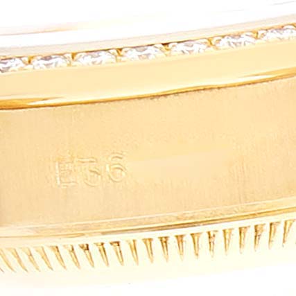 This image shows a close-up of the bezel and part of the bracelet of the Rolex President 69138 Women
s Yellow Gold Champagne Dial 69138 Women
s Yellow Gold Champagne Dial model watch.