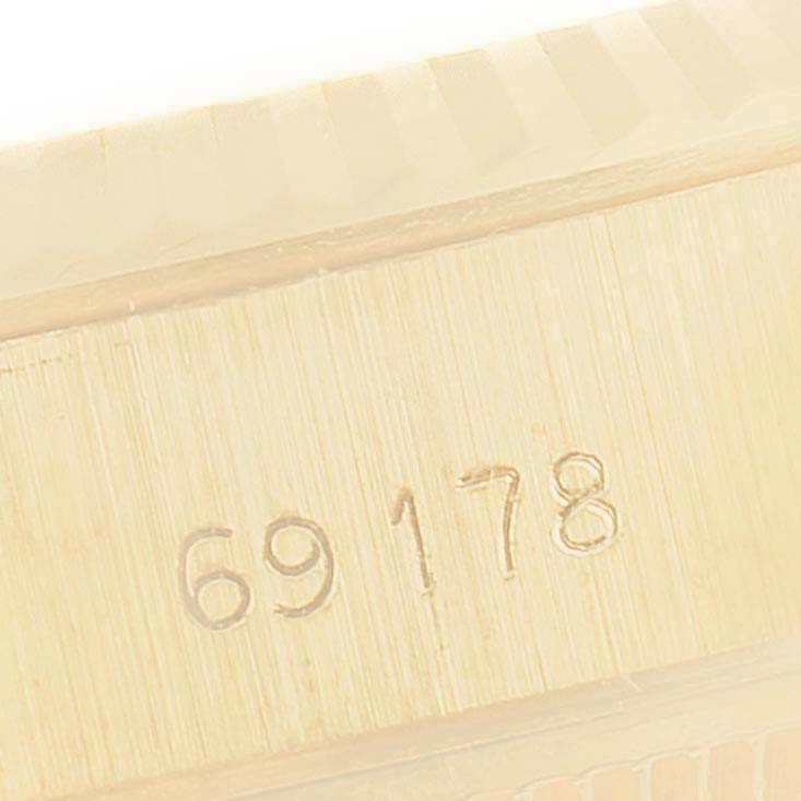 This close-up image shows the model number engraving on the case of a Rolex President 69178 Women
s Yellow Gold Champagne Dial 69178 Women
s Yellow Gold Champagne Dial watch.
