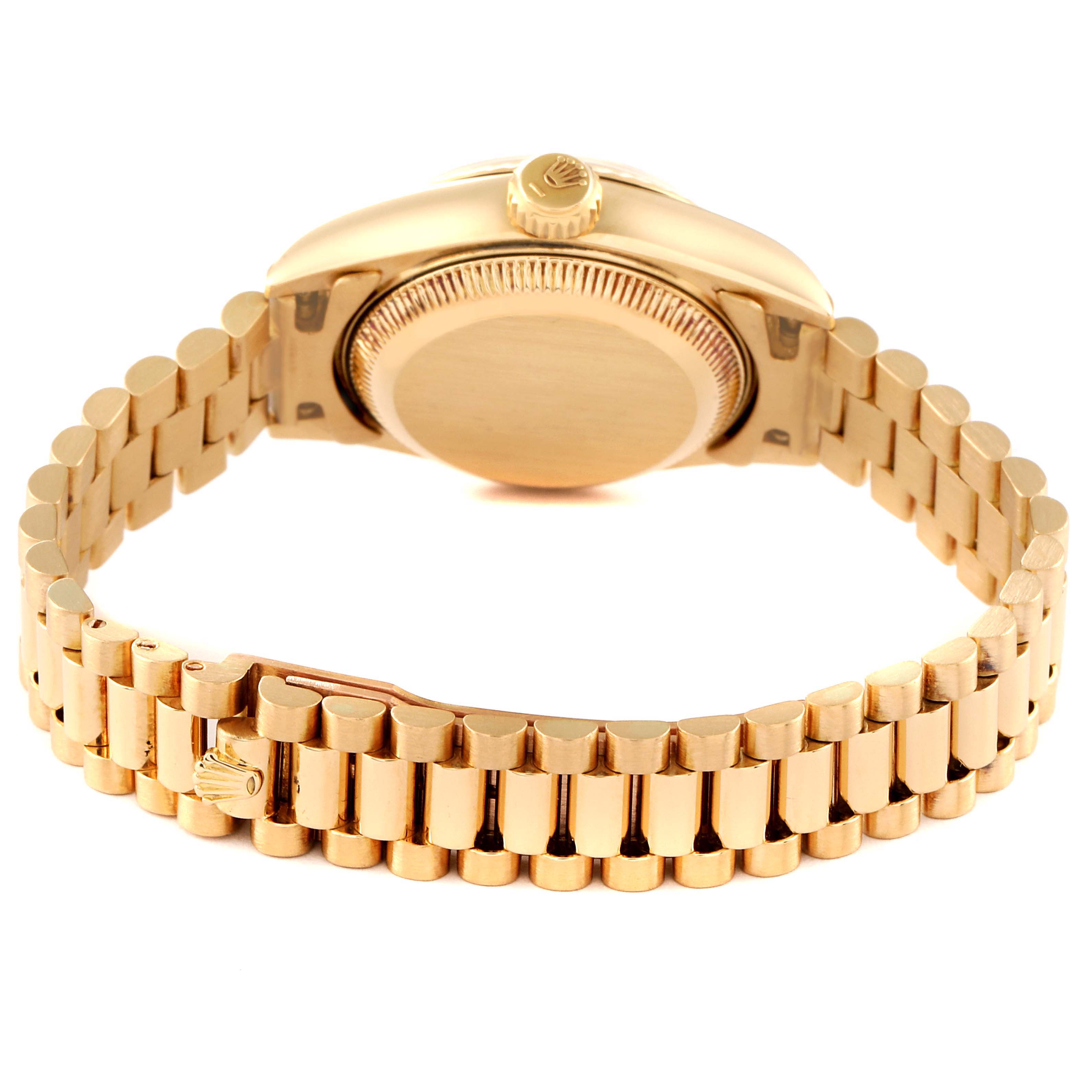 The image shows the back side of a Rolex President 69178 Women
s Yellow Gold Champagne Dial 69178 Women
s Yellow Gold Champagne Dial model watch, highlighting the case back and bracelet.