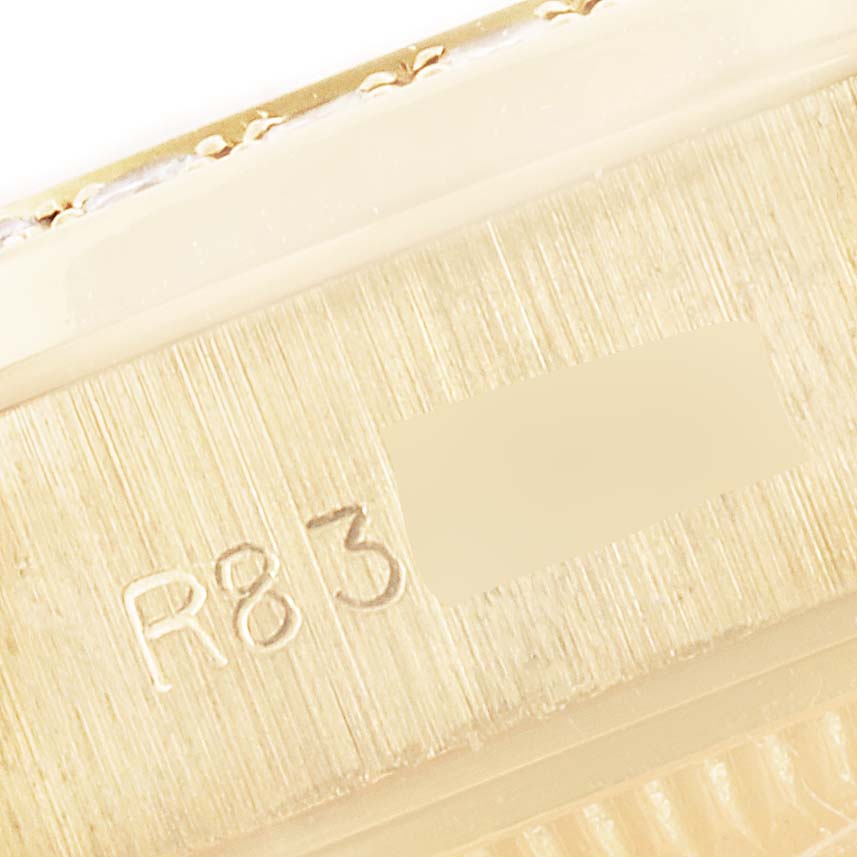The image shows a close-up view of the serial number engraving on the President model by Rolex.