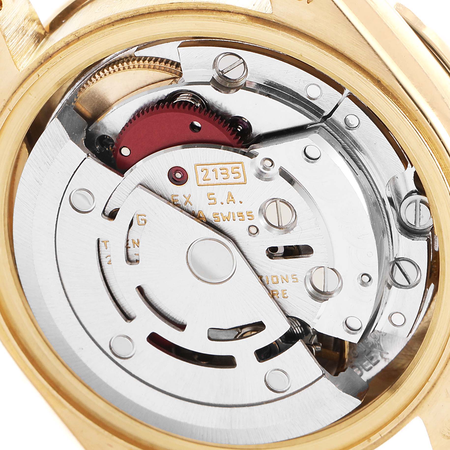 The image shows the intricate internal mechanism of a Rolex President 69138 Women's Yellow Gold Champagne Dial 69138 Women's Yellow Gold Champagne Dial model watch from a close-up, rear angle.