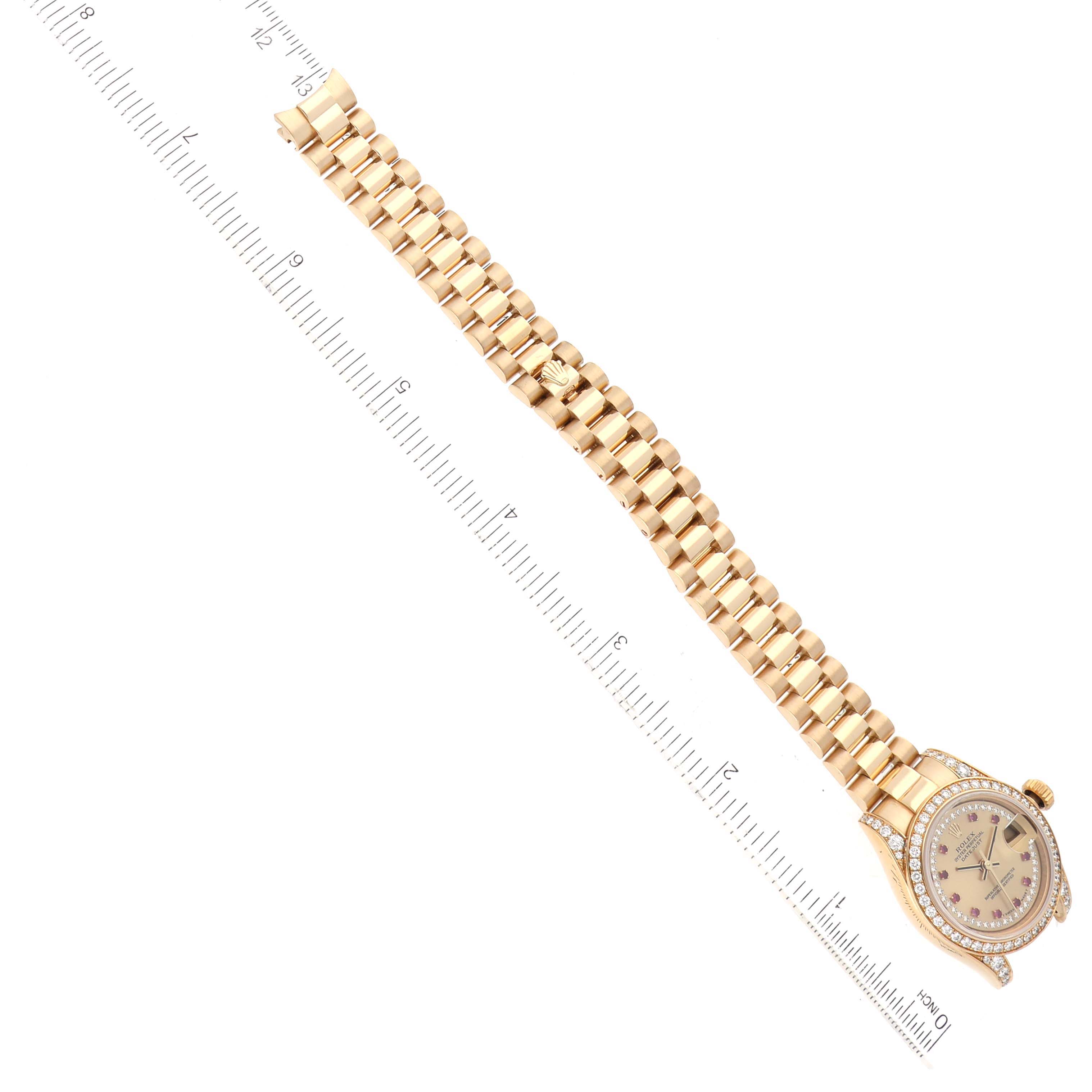 The image shows a top view of the Rolex President 179158 Women's Yellow Gold Champagne Dial 179158 Women's Yellow Gold Champagne Dial model watch, featuring its strap, face, and bezel.