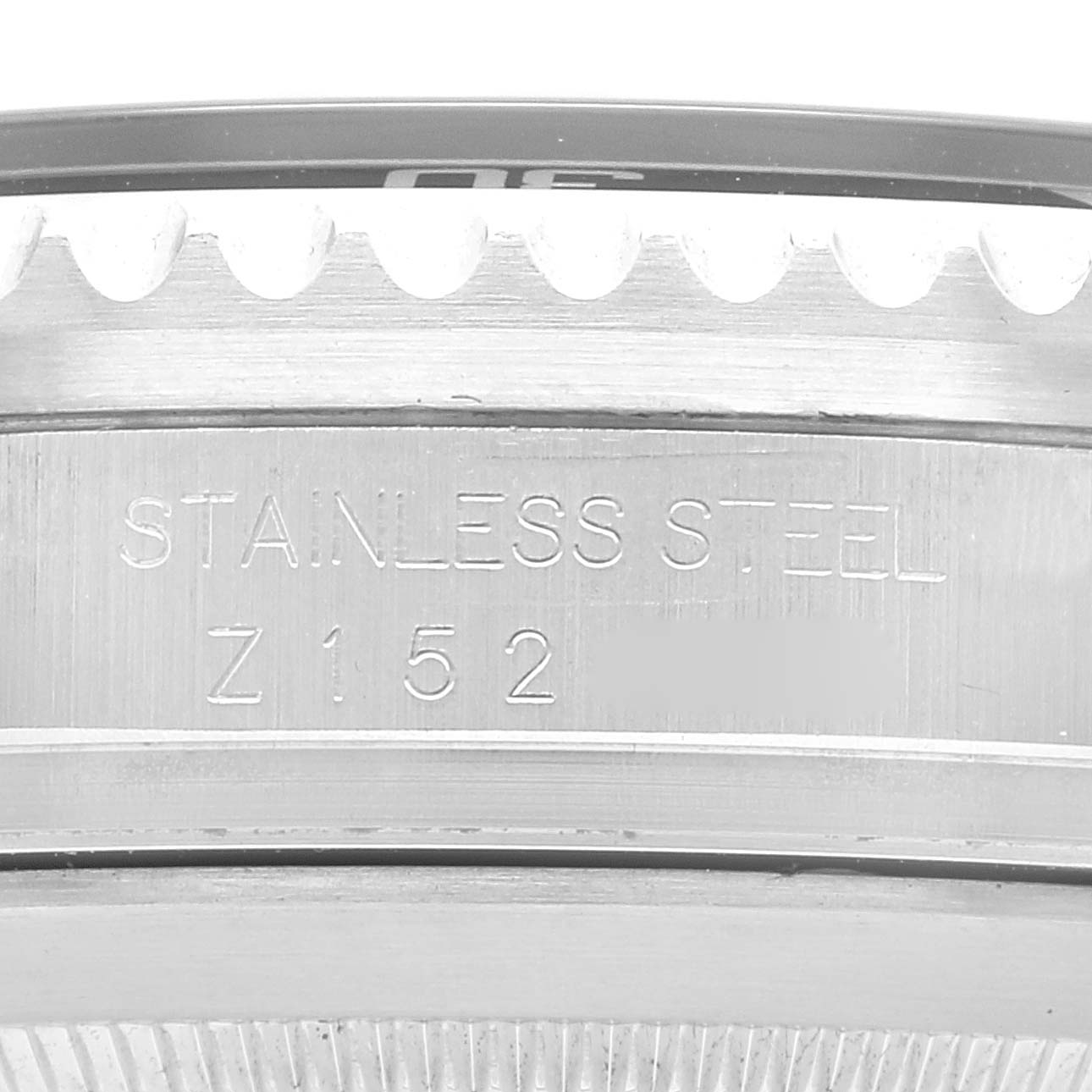 This image shows a close-up angle of the case side of a Rolex Sea-Dweller 16600 Men
s Stainless Steel Black Dial 16600 Men
s Stainless Steel Black Dial, highlighting the engraving "STAINLESS STEEL" and a serial number.