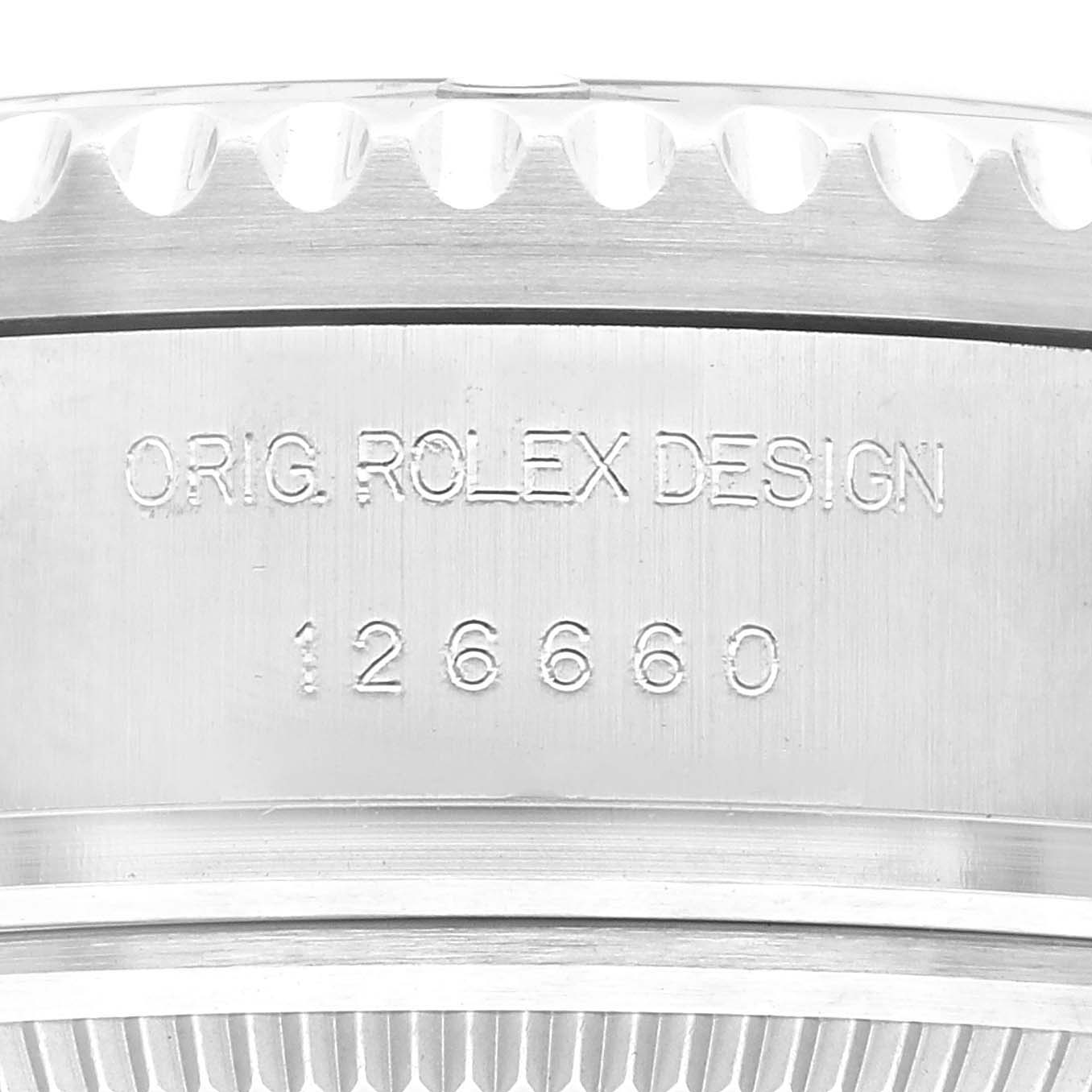The image shows a close-up of the side and bezel of a Rolex Sea-Dweller 126660 Men
s Stainless Steel Black Dial 126660 Men
s Stainless Steel Black Dial watch, displaying the model number 126660 and "ORIG. ROLEX DESIGN."