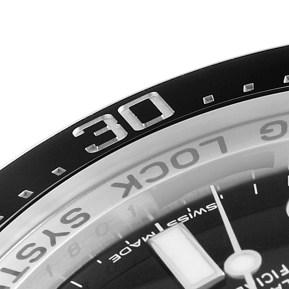 This image showcases a close-up of the bezel and part of the dial of a Rolex Sea-Dweller 116660 Men's Stainless Steel Blue Dial 116660 Men's Stainless Steel Blue Dial watch.