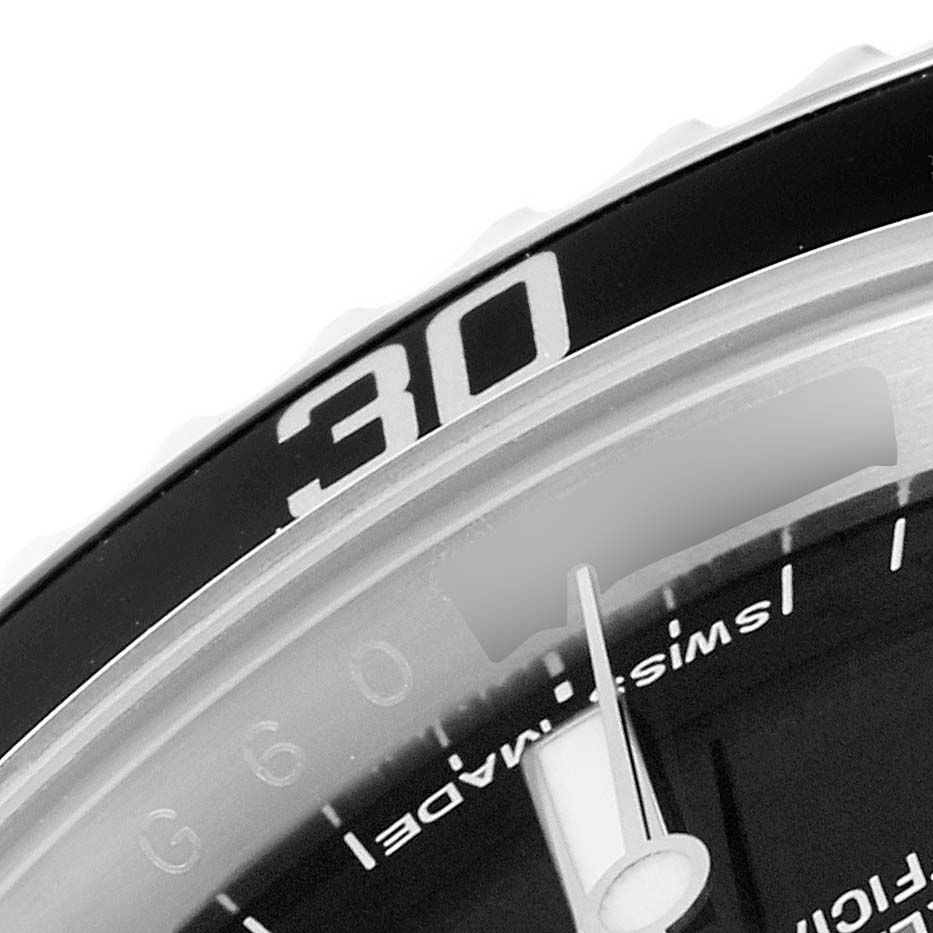 The close-up image of the Rolex Submariner 14060 Men's Stainless Steel Black Dial 14060 Men's Stainless Steel Black Dial watch shows a portion of the bezel with the "30" marking and part of the dial with the hands.