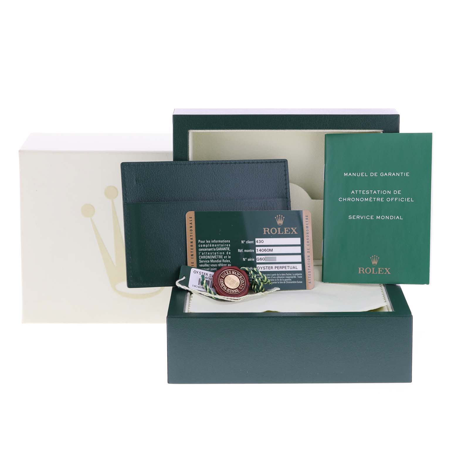 The image shows the packaging and accessories for a Rolex Submariner 14060 Men's Stainless Steel Black Dial 14060 Men's Stainless Steel Black Dial watch, including warranty cards, booklet, and tags.