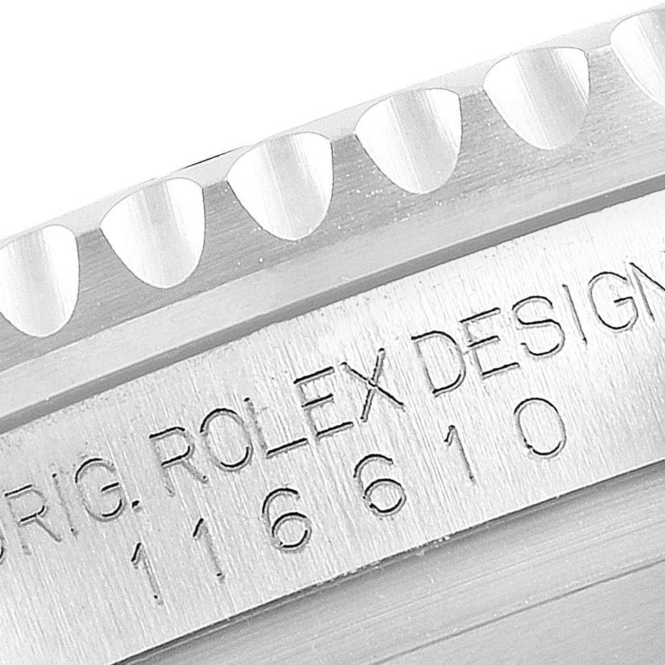 Close-up of the side of a Rolex Submariner 116610LN Men
s Stainless Steel Black Dial 116610LN Men
s Stainless Steel Black Dial showing the engraved model number and part of the bezel.