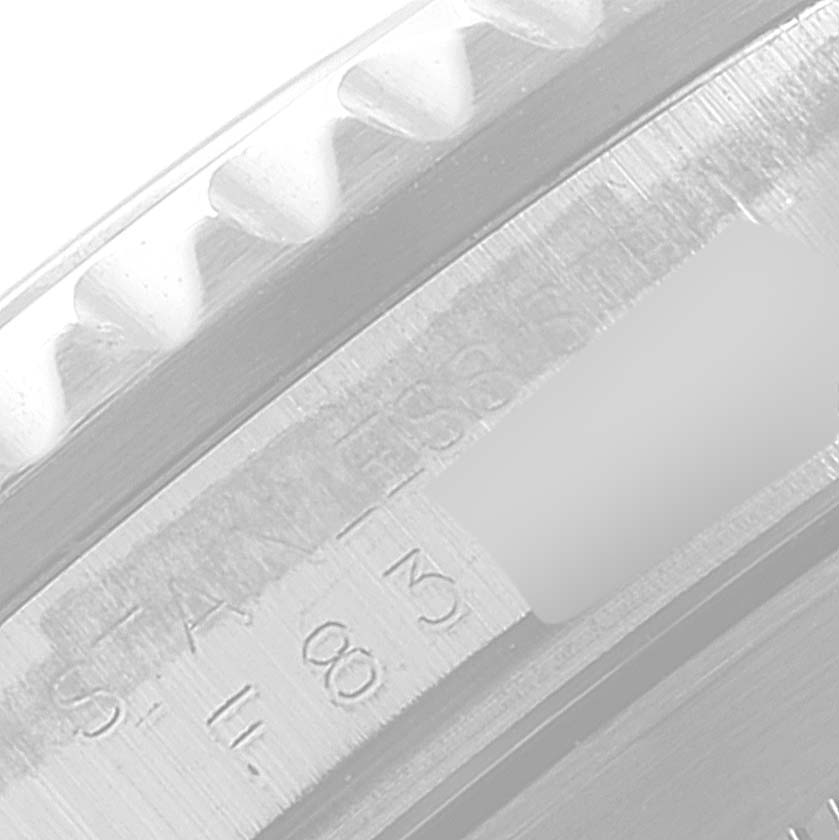 The image shows a close-up of the inner bezel and part of the serial number of a Rolex Submariner 16610 Men's Stainless Steel Black Dial 16610 Men's Stainless Steel Black Dial watch.