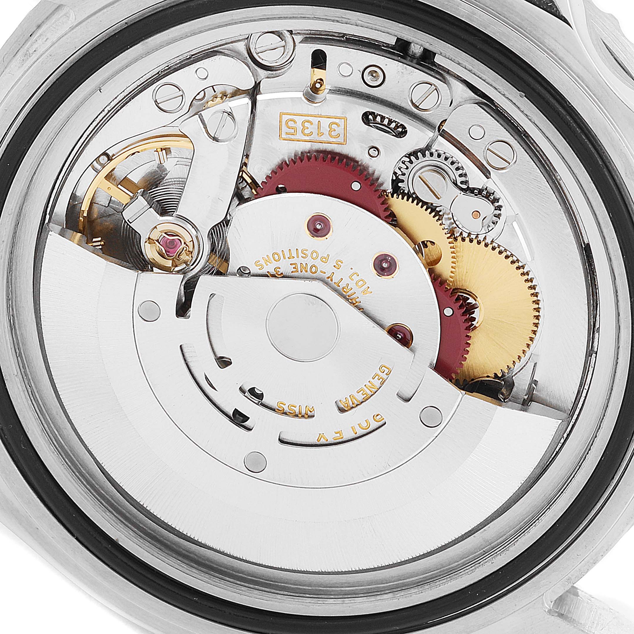 This image shows the back view of the Rolex Submariner 16610 Men's Stainless Steel Black Dial 16610 Men's Stainless Steel Black Dial, highlighting its intricate mechanical movement parts.