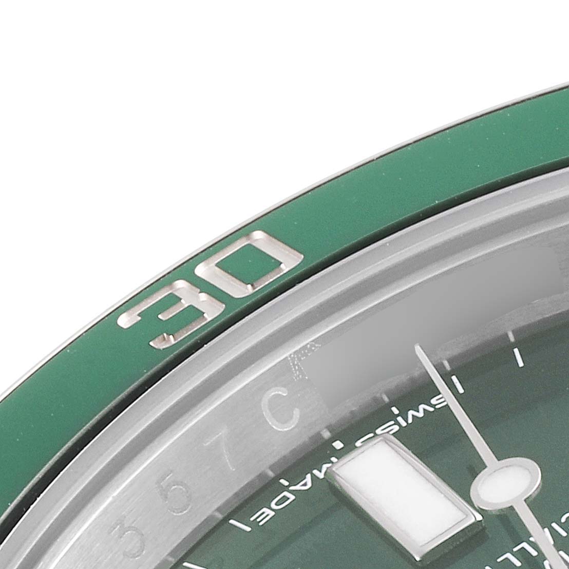 The image shows a close-up of the bezel and part of the dial from the Rolex Submariner 116610LV Men
s Stainless Steel Green Dial 116610LV Men
s Stainless Steel Green Dial watch.