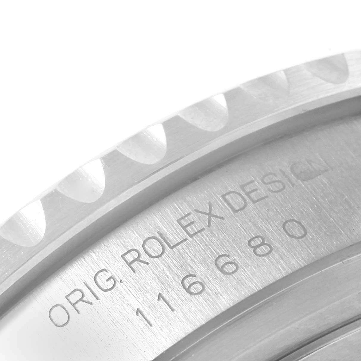 The image shows a close-up of the case-back edge of a Rolex Yacht-Master 116680 Men
s Stainless Steel White Dial 116680 Men
s Stainless Steel White Dial, displaying the engraved model number and "ORIG. ROLEX DESIGN."