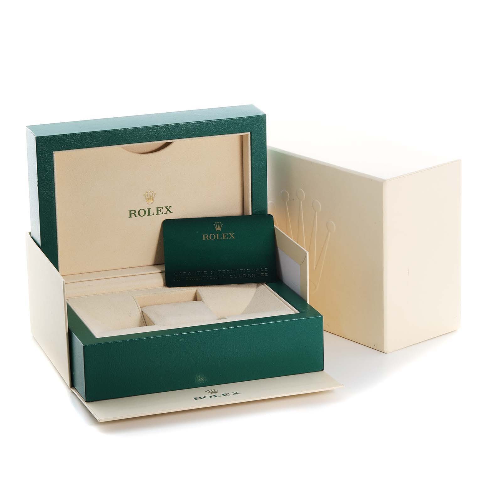 This image shows the packaging and accessories for the Yacht-Master model by Rolex, including the watch box and warranty card.