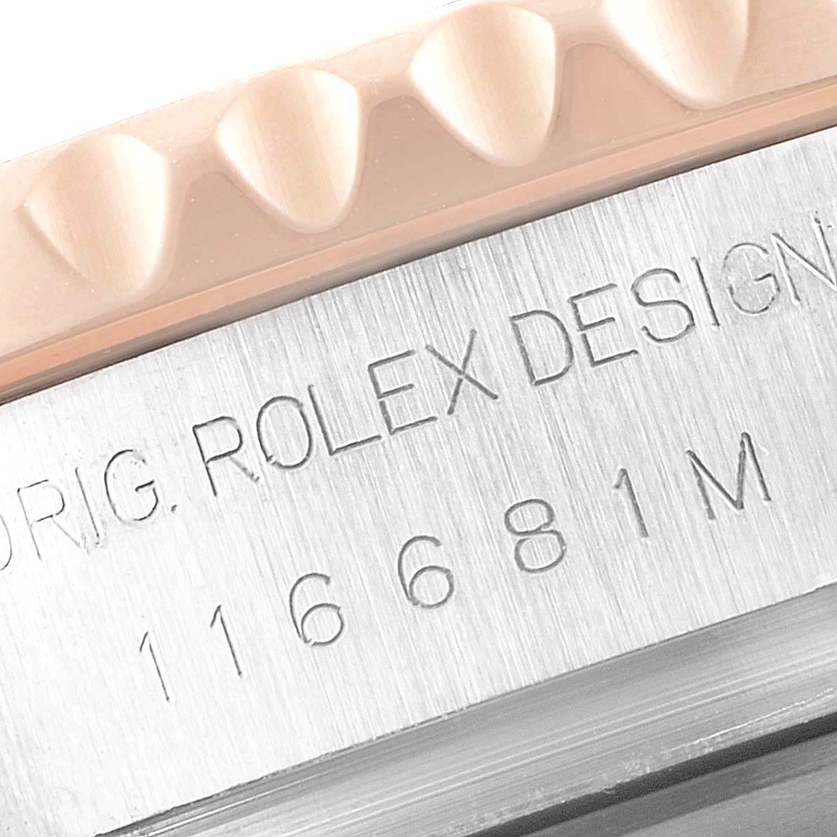 This close-up image shows the bezel and engraved serial number of the Rolex Yacht-Master 116681 Men
s Steel and Gold (two tone) White Dial 116681 Men
s Steel and Gold (two tone) White Dial watch.