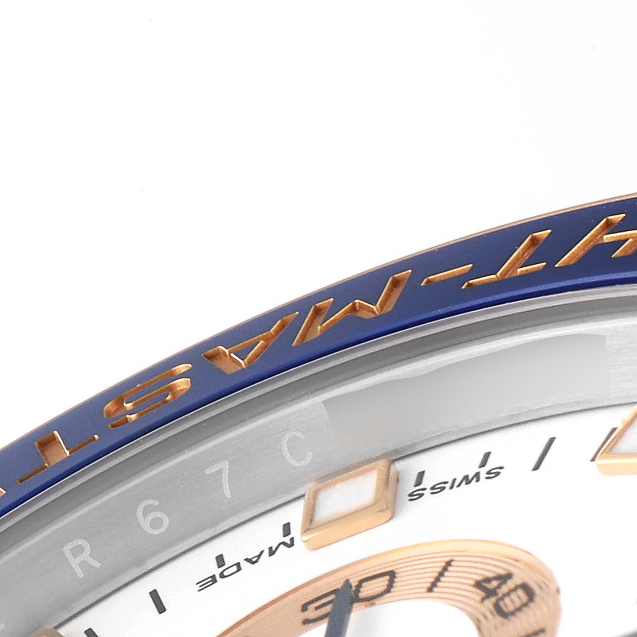 This image shows a close-up of the bezel and part of the dial of a Rolex Yacht-Master 116681 Men
s Steel and Gold (two tone) White Dial 116681 Men
s Steel and Gold (two tone) White Dial watch, highlighting the "YACHT-MASTER" engraving.