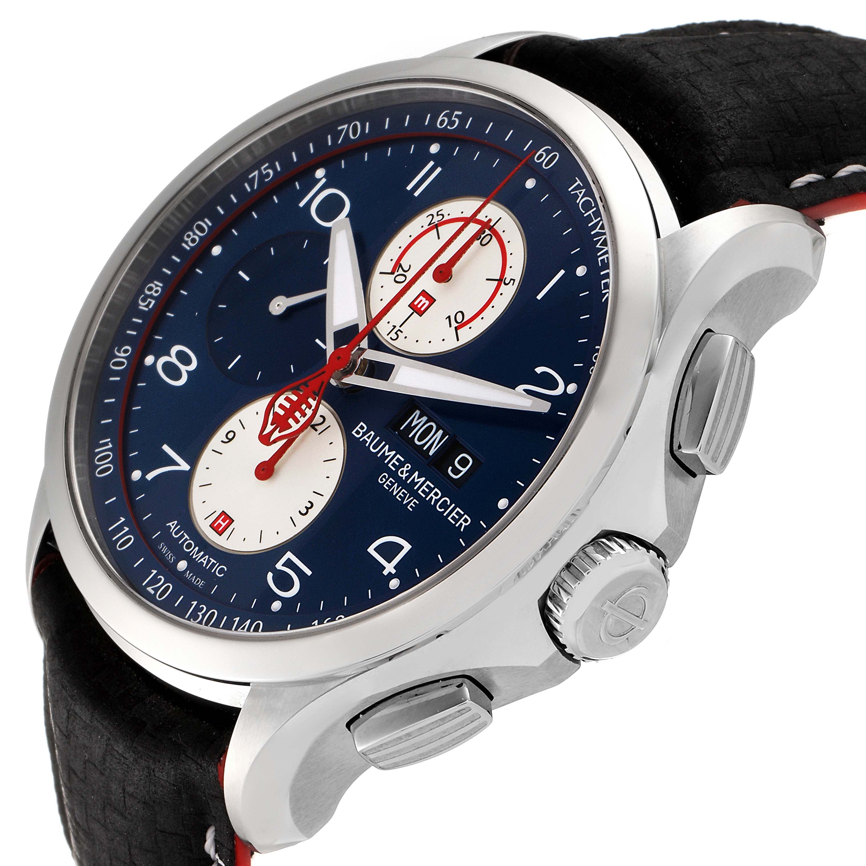 The image shows a Baume & Mercier Clifton M0A10342 Men's Stainless Steel Blue Dial M0A10342 Men's Stainless Steel Blue Dial model watch angled to highlight its face, crown, and pushers.