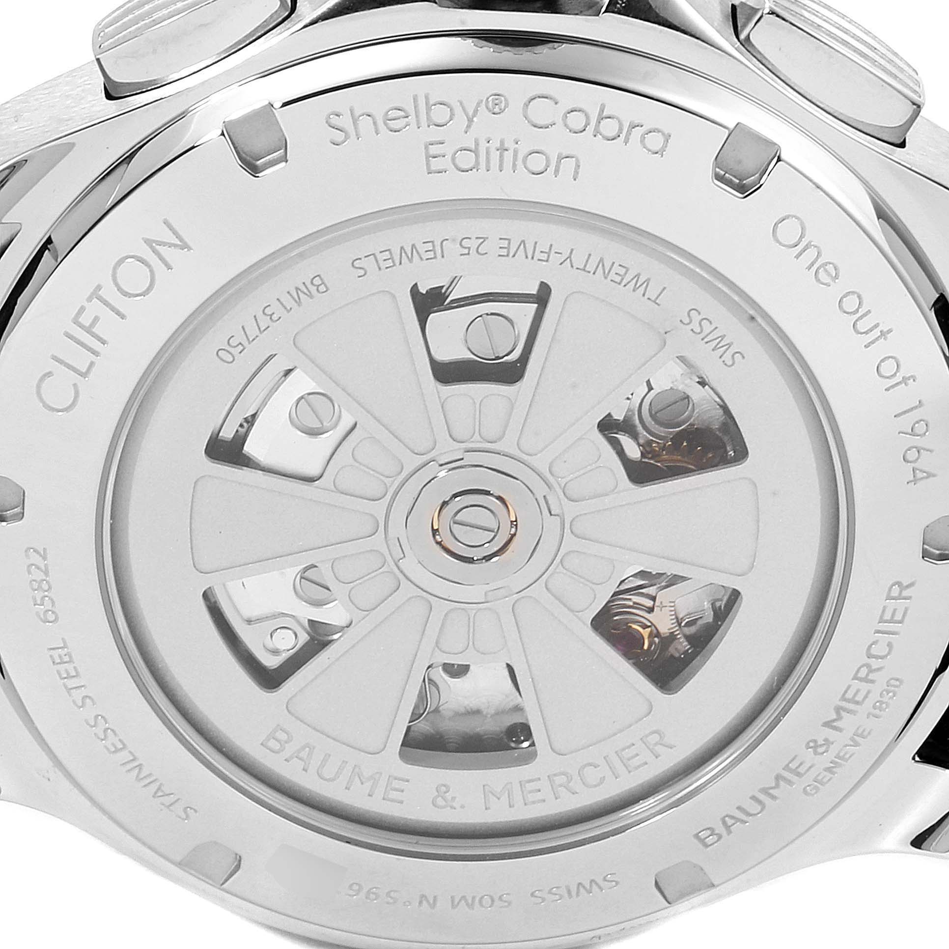 The image shows the back view of the Baume & Mercier Clifton M0A10342 Men's Stainless Steel Silver Dial M0A10342 Men's Stainless Steel Silver Dial Shelby Cobra Edition watch, highlighting its intricate mechanism and engravings.