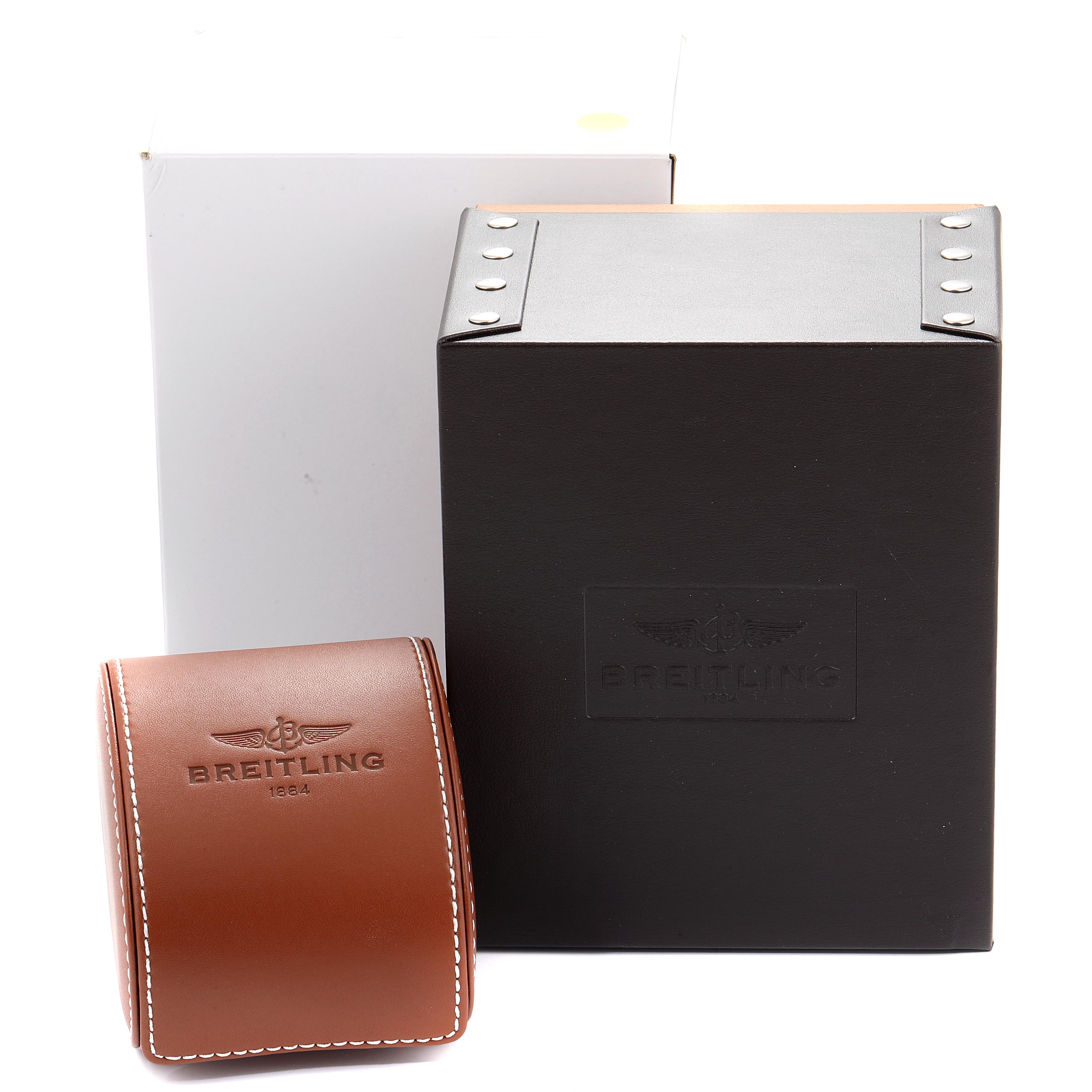 The image shows packaging for a Bentley model Breitling watch, including a leather case with the Breitling logo and an outer box.