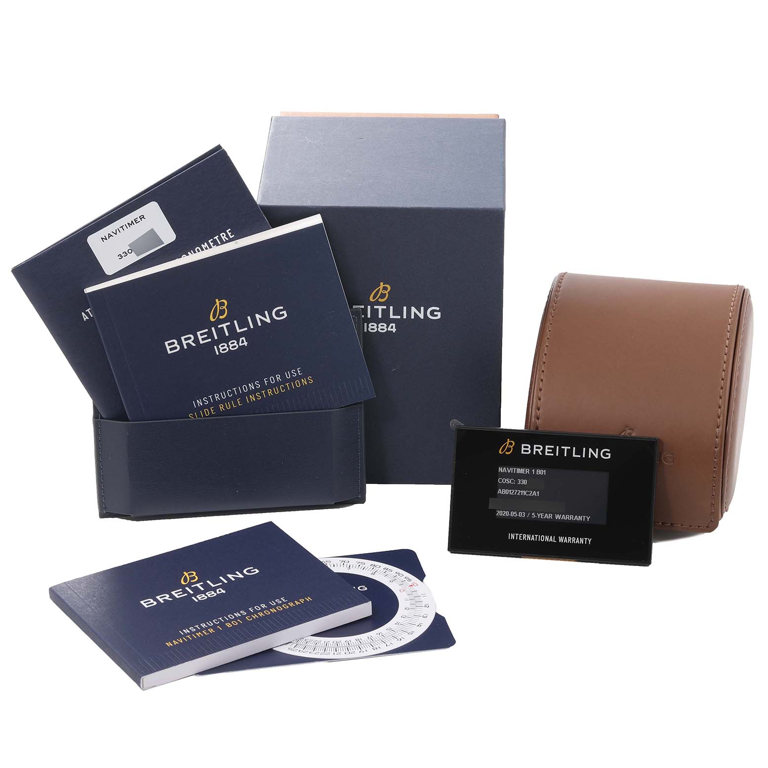 This image shows the packaging and accessories for a Breitling Navitimer AB0127 Men's Stainless Steel Blue Dial AB0127 Men's Stainless Steel Blue Dial watch, including instruction manuals and a watch case.