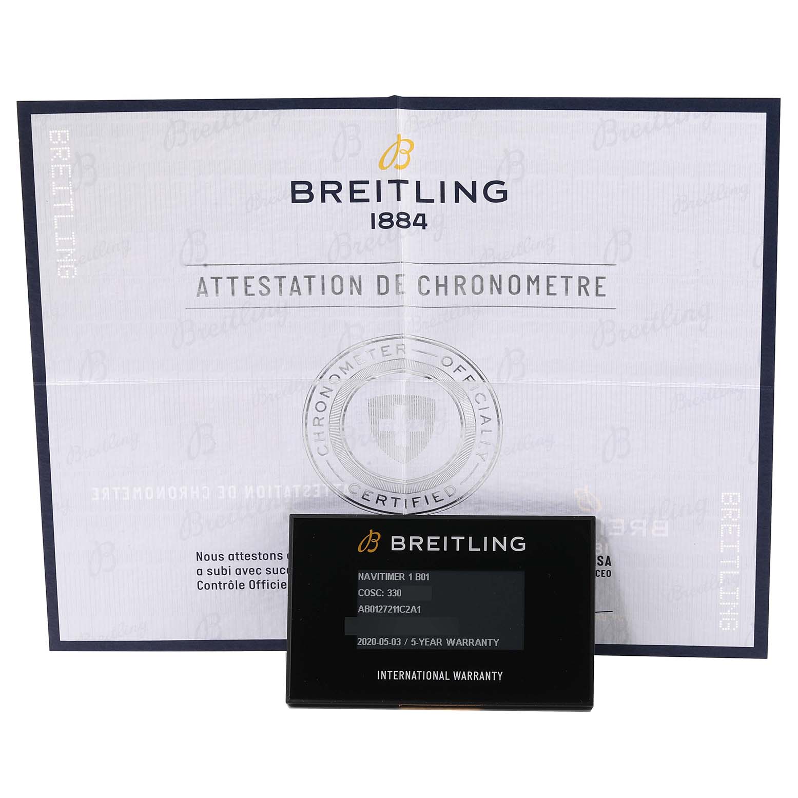 The image shows the Breitling Navitimer AB0127 Men's Stainless Steel Blue Dial AB0127 Men's Stainless Steel Blue Dial's chronometer certification and international warranty card.