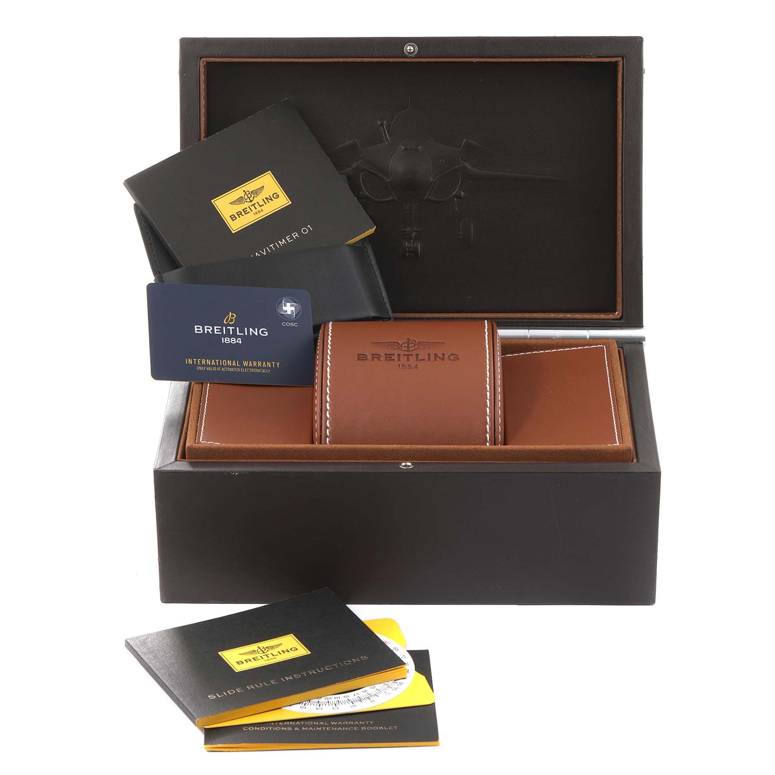 The image shows a top-down view of Breitling Navitimer RB0120 Men
s Rose Gold Black Dial RB0120 Men
s Rose Gold Black Dial watch accessories, including a warranty card, instruction booklets, and a leather case inside a box.