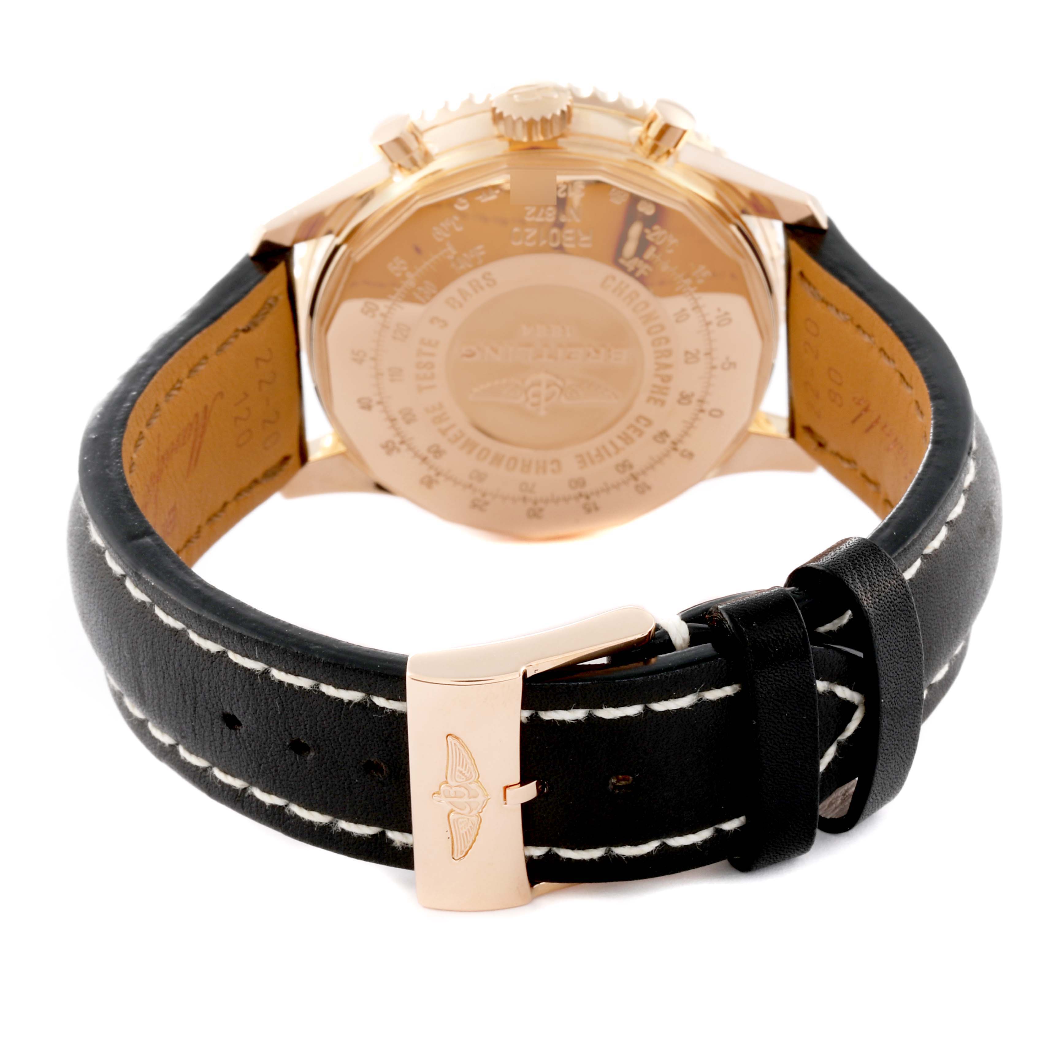 The image shows the rear view of a Breitling Navitimer RB0120 Men
s Rose Gold Black Dial RB0120 Men
s Rose Gold Black Dial watch, highlighting its back casing and black leather strap with a gold buckle.